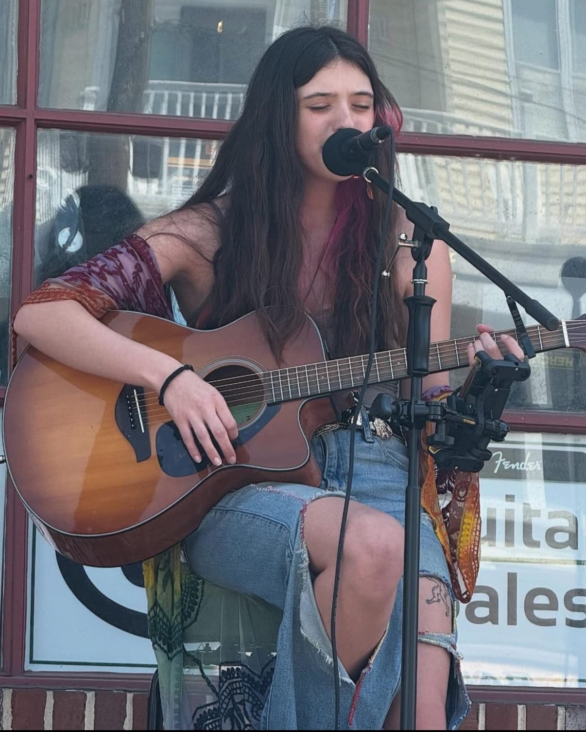 Large photos of other Yilk playing a live performance
