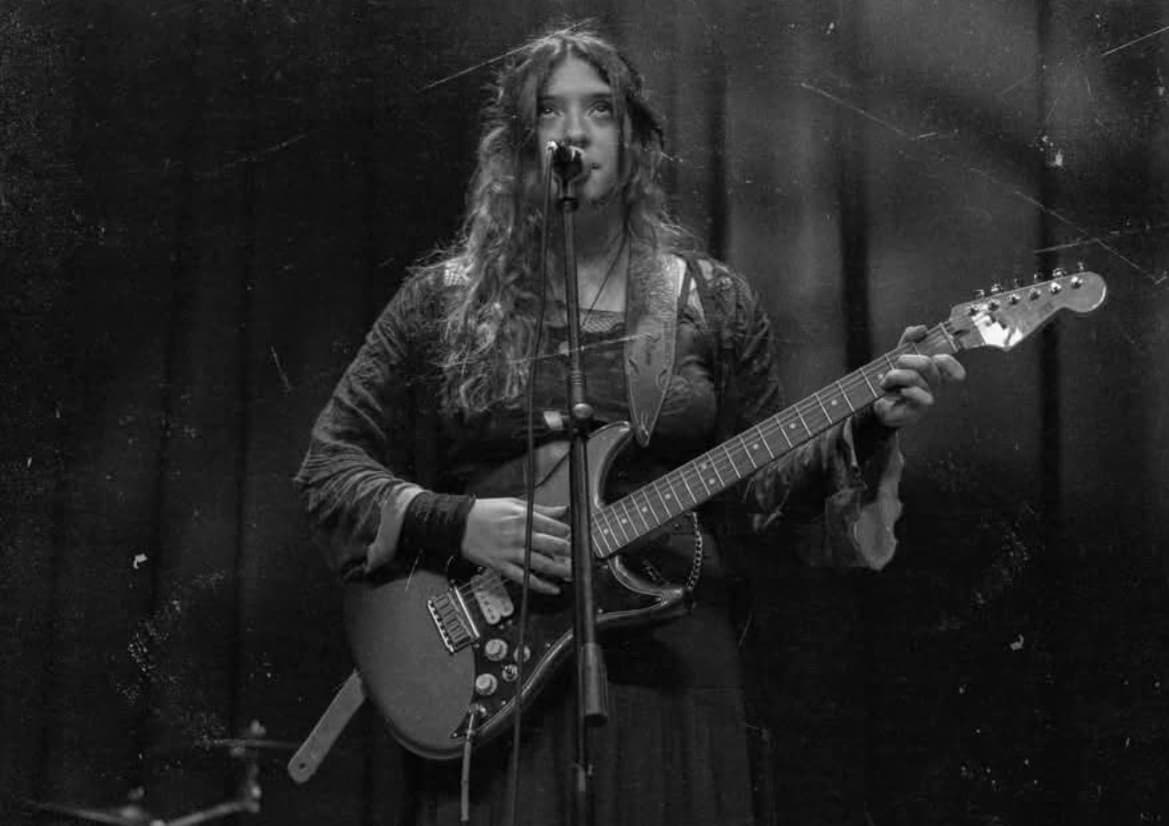Large photos of other Yilk playing a live performance
